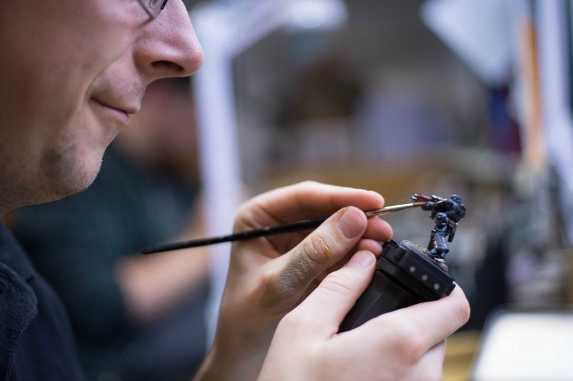 Games Workshop design employee painting miniature