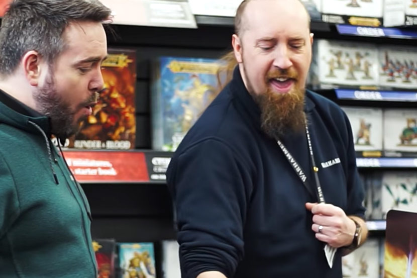 Warhammer World employee interacting with customer